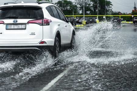 Odessa, Ukraine - August 9, 2019: driving car on flooded road during flood caused by torrential...