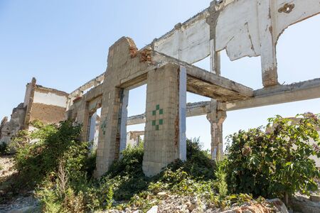 Ruined house. Remains of old houses. Apocalypse. Abandoned city. City of ghosts. Ruins of old...