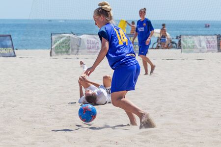 Odessa, Ukraine-July 21, 2019: Beach Soccer Championship among amateur women on beach. Soccer in sand. Young beautiful girls playing beach football on sand of city beach. Football on sandのeditorial素材