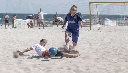 Odessa, Ukraine-July 21, 2019: Beach Soccer Championship among amateur women on beach. Soccer in sand. Young beautiful girls playing beach football on sand of city beach. Football on sandのeditorial素材