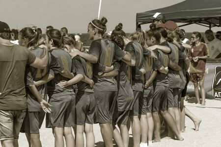 Odessa, Ukraine-July 21, 2019: Beach Soccer Championship among amateur women on beach. Soccer in sand. Young beautiful girls playing beach football on sand of city beach. Football on sandのeditorial素材