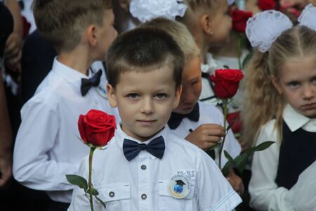 ODESSA UKRAINE - September 1, 2019: First call. 1 September is Day of Knowledge. Solemn school line, first grade, back to school. School holiday Knowledge Day. Little schoolchildren, first gradersのeditorial素材