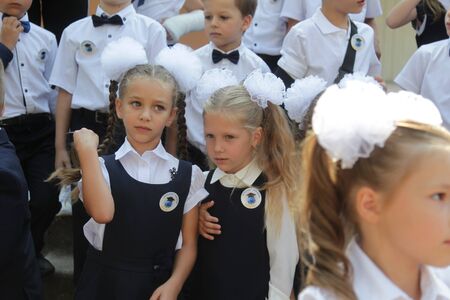 ODESSA UKRAINE - September 1, 2019: First call. 1 September is Day of Knowledge. Solemn school line, first grade, back to school. School holiday Knowledge Day. Little schoolchildren, first gradersのeditorial素材