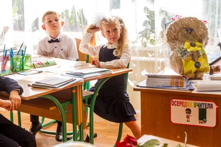 ODESSA UKRAINE - September 1, 2019: First call. 1 September is Day of Knowledge. Solemn school line, first grade, back to school. School holiday Knowledge Day. Little schoolchildren, first gradersのeditorial素材