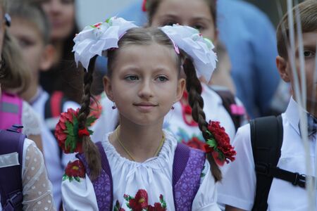 ODESSA UKRAINE - September 1, 2019: First call. 1 September is Day of Knowledge. Solemn school line, first grade, back to school. School holiday Knowledge Day. Little schoolchildren, first gradersのeditorial素材