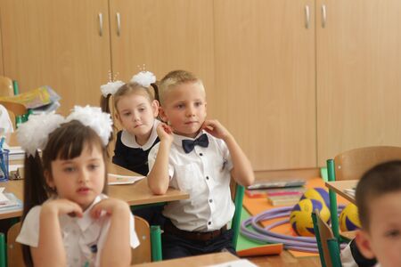 ODESSA UKRAINE - September 1, 2019: First call. 1 September is Day of Knowledge. Solemn school line, first grade, back to school. School holiday Knowledge Day. Little schoolchildren, first gradersのeditorial素材
