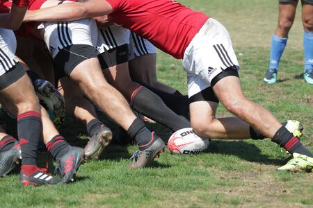 ODESSA, UKRAINE - SEPTEMBER 7, 2019: National team of Odessa Rugby Championship - Kremenchug. Intense struggle of rugby players for ball. Dynamic game on green field of stadium. Fierce Rugby Fightのeditorial素材
