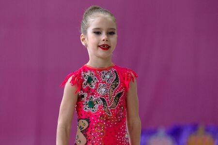 ODESSA, UKRAINE - September 21, 2019: children, girls compete in rhythmic gymnastics at Ukrainian championship in rhythmic gymnastics among children. Young gymnasts competing in arena of the gymのeditorial素材