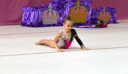 ODESSA, UKRAINE - September 21, 2019: children, girls compete in rhythmic gymnastics at Ukrainian championship in rhythmic gymnastics among children. Young gymnasts competing in arena of the gymのeditorial素材