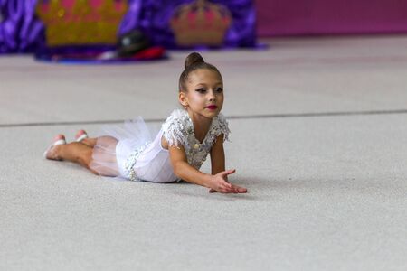 ODESSA, UKRAINE - September 21, 2019: children, girls compete in rhythmic gymnastics at Ukrainian championship in rhythmic gymnastics among children. Young gymnasts competing in arena of the gymのeditorial素材
