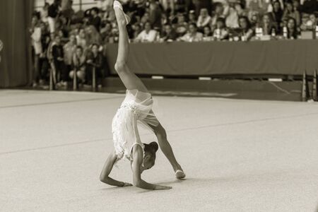 ODESSA, UKRAINE - September 21, 2019: children, girls compete in rhythmic gymnastics at Ukrainian championship in rhythmic gymnastics among children. Young gymnasts competing in arena of the gymのeditorial素材