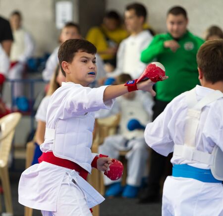 Odessa, Ukraine - September 30, 2019: Karate Championship among children of athletes. Best karate fighters from demonstrate their ability to fight obscenities. Battle of young karate cadetsのeditorial素材
