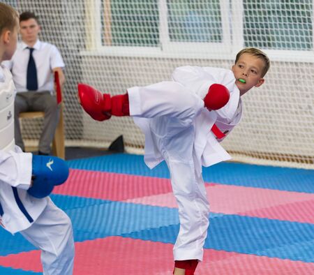 Odessa, Ukraine - September 30, 2019: Karate Championship among children of athletes. Best karate fighters from demonstrate their ability to fight obscenities. Battle of young karate cadetsのeditorial素材