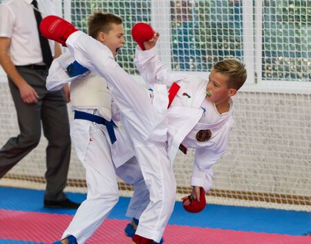 Odessa, Ukraine - September 30, 2019: Karate Championship among children of athletes. Best karate fighters from demonstrate their ability to fight obscenities. Battle of young karate cadetsのeditorial素材