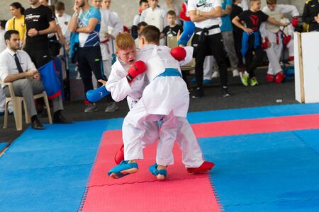 Odessa, Ukraine - September 30, 2019: Karate Championship among children of athletes. Best karate fighters from demonstrate their ability to fight obscenities. Battle of young karate cadetsのeditorial素材