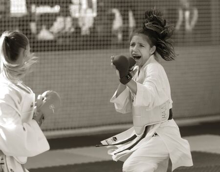 Odessa, Ukraine - September 30, 2019: Karate Championship among children of athletes. Best karate fighters from demonstrate their ability to fight obscenities. Battle of young karate cadetsのeditorial素材