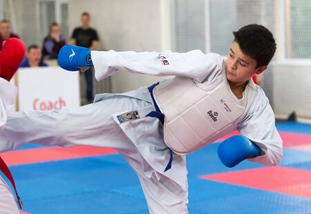 Odessa, Ukraine - September 30, 2019: Karate Championship among children of athletes. Best karate fighters from demonstrate their ability to fight obscenities. Battle of young karate cadetsのeditorial素材