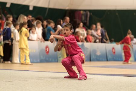 ODESSA, UKRAINE - October 1, 2019: Wushu athlete during the Wushu competition among children. Young...
