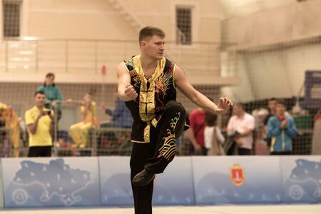 ODESSA, UKRAINE - October 1, 2019: Wushu athlete during the Wushu competition among children. Young...