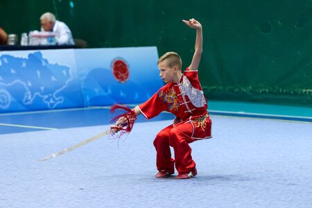 ODESSA, UKRAINE - October 1, 2019: Wushu athlete during the Wushu competition among children. Young...