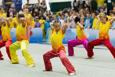 ODESSA, UKRAINE - October 1, 2019: Wushu athlete during the Wushu competition among children. Young athletes in competitions perform Chinese martial arts called Shaolin Kung Fu (Shaolin Wushu)のeditorial素材