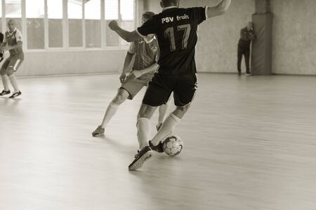 Odessa, Ukraine - October 6, 2019: Unidentified local team players play indoor soccer futsal...