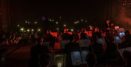 ODESSA, UKRAINE - October 15, 2019: Spectators at a concert in the theater enjoy a performance of the popular NAOMI national instrument orchestraのeditorial素材