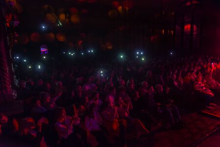 ODESSA, UKRAINE - October 15, 2019: Spectators at a concert in the theater enjoy a performance of...
