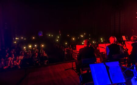 ODESSA, UKRAINE - October 15, 2019: Spectators at a concert in the theater enjoy a performance of the popular NAOMI national instrument orchestraのeditorial素材