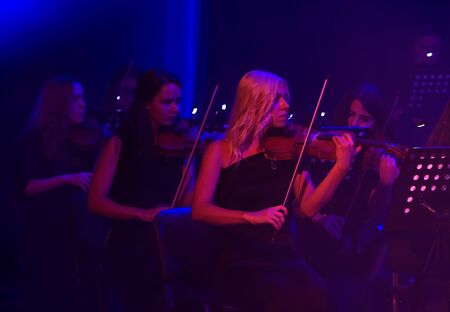 ODESSA, UKRAINE - July 16, 2019: Concert of the Andrei Cherny Symphony Orchestra on the theatrical stage of the Odessa Opera House. Musicians of the symphony orchestra perform OSCAR cinematic hitsのeditorial素材