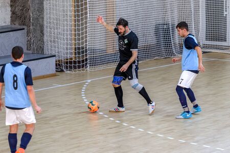 ODESSA, UKRAINE December 15, 2019: Unidentified local team players play futsal futsal tournament on...