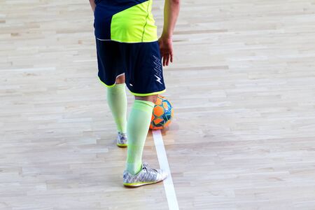 ODESSA, UKRAINE - CIRKA, 202020: Unidentified local team players play futsal futsal tournament on the parquet floor. The right moment of a sports soccer game in an indoor hall, indoor soccerのeditorial素材