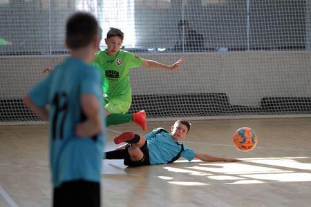 Odessa, Ukraine- Febr 17, 2020: Little boys, children play mini football in sports hall at sports city Junior championship. Children's sport is healthy lifestyle. Sports children football playersのeditorial素材