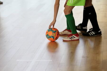 Odessa, Ukraine- Febr 17, 2020: Little boys, children play mini football in sports hall at sports...