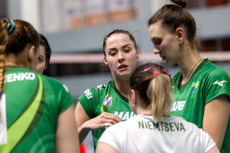 KAMENSKY, Ukraine-February 14, 2020. Ukrainian Volleyball Cup of Ukraine. Champion of Ukraine VC KHIMIK Yuzhny (green). Winning Women Volleyball Champions Game.  Intense game of women's sportsのeditorial素材