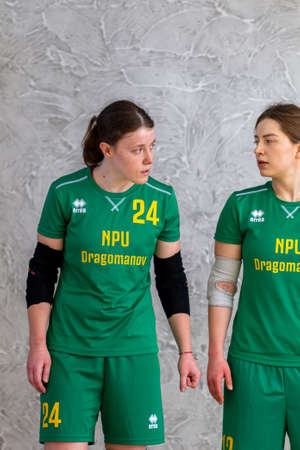 ODESSA, UKRAINE - March 13, 2020: Futsal Cup of Ukraine, futsal among students. During final match in futsal among student teams. Beautiful sports girls play mini football on parquet floorのeditorial素材