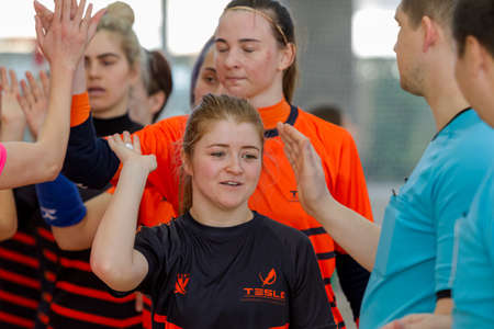 ODESSA, UKRAINE - March 13, 2020: Futsal Cup of Ukraine, futsal among students. During final match in futsal among student teams. Beautiful sports girls play mini football on parquet floorのeditorial素材