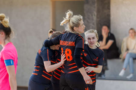 ODESSA, UKRAINE - March 13, 2020: Futsal Cup of Ukraine, futsal among students. During final match in futsal among student teams. Beautiful sports girls play mini football on parquet floorのeditorial素材