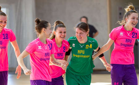 ODESSA, UKRAINE - March 13, 2020: Futsal Cup of Ukraine, futsal among students. During final match in futsal among student teams. Beautiful sports girls play mini football on parquet floorのeditorial素材