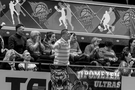 KAMENSKY, Ukraine - February 14, 2020. Sports spectators, fans do not support their team during women's volleyball tournament. Sports fans, ultras on grandstandのeditorial素材