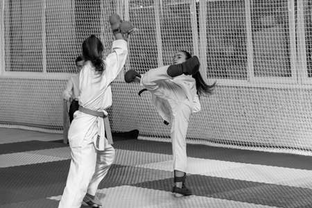 Odessa, Ukraine - September 30, 2019: Karate Championship among children of athletes. The best karate fighters children girls demonstrate their ability to fight on tatami. Battle of karate young girlsのeditorial素材