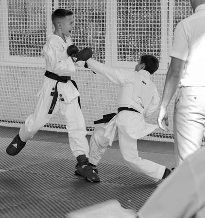 Odessa, Ukraine - September 30, 2019: Karate Championship among children of athletes. Best karate fighters children demonstrate their ability to fight on tatami. Battle of karate. Children's sportsのeditorial素材