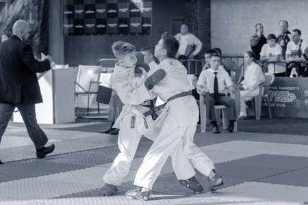 Odessa, Ukraine - September 30, 2019: Karate Championship among children of athletes. Best karate fighters children demonstrate their ability to fight on tatami. Battle of karate. Children's sportsのeditorial素材