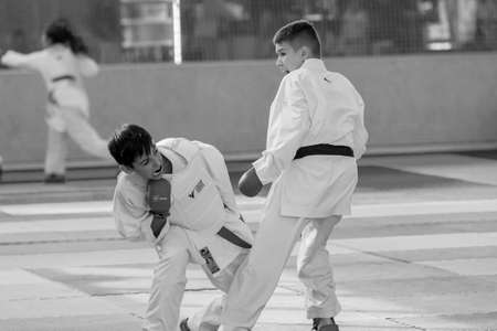 Odessa, Ukraine - September 30, 2019: Karate Championship among children of athletes. Best karate fighters children demonstrate their ability to fight on tatami. Battle of karate. Children's sportsのeditorial素材