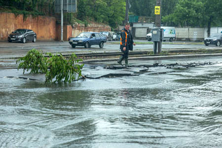 Odessa, Ukraine - May 28, 2020: driving car on flooded road during flood caused by torrential rains....