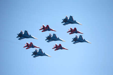 MOSCOW, RUSSIA - June 24, 2020: an air parade flight of Russian aircraft of the Russian Knights aerobatic groups on Su-30SM and Swifts on MiG-29 the victory Parade in Great Patriotic war over Moscowのeditorial素材