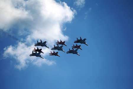 MOSCOW, RUSSIA - June 24, 2020: an air parade flight of Russian aircraft of the Russian Knights aerobatic groups on Su-30SM and Swifts on MiG-29 the victory Parade in Great Patriotic war over Moscowのeditorial素材
