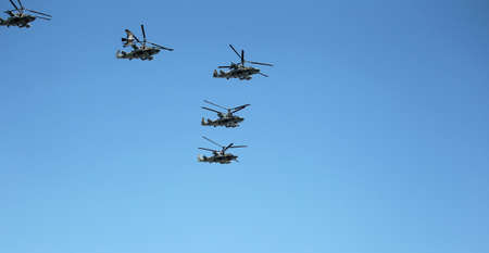 MOSCOW, RUSSIA - June 24,2020. An air parade of military combat helicopters of Russian Air Force fly in skies of Moscow over Kremlin and Red Square in 75th anniversary of Victory during Victory Paradeのeditorial素材
