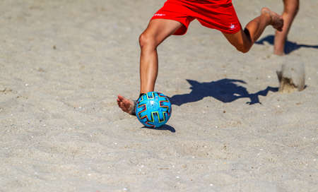 Odessa, Ukraine-July 25, 2020: Beach Soccer Championship among amateur women on beach. Soccer in sand. Young beautiful girls playing beach football on sand of city beach. Football on sandのeditorial素材