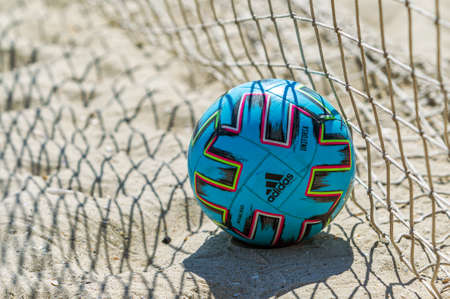 Odessa, Ukraine-July 25, 2020: Beach Soccer Championship among amateur women on beach. Soccer in sand. Young beautiful girls playing beach football on sand of city beach. Football on sandのeditorial素材